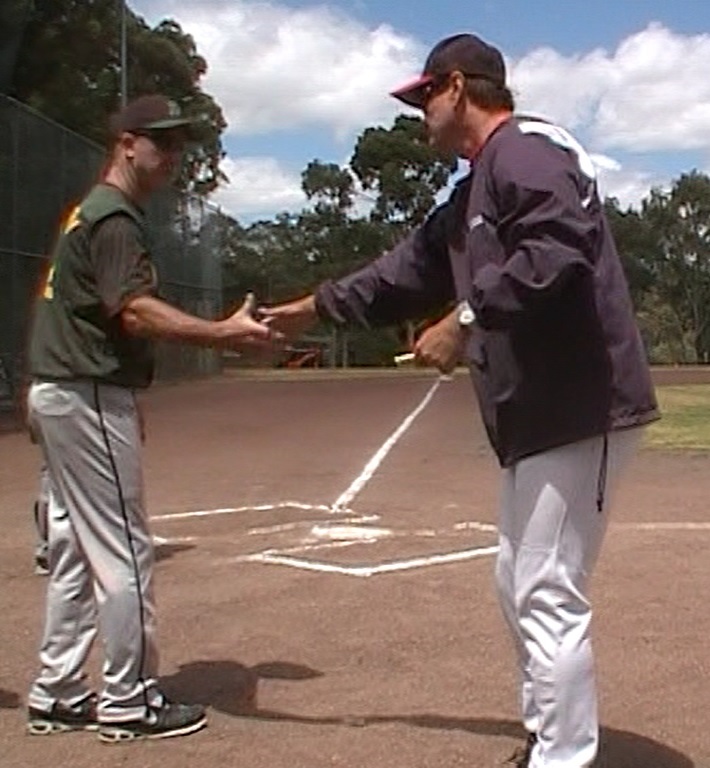 Essendon Women's coach - Ron Copperwaite at home plate with Colin Penny, who would 2 year later coach Essendon Women's team